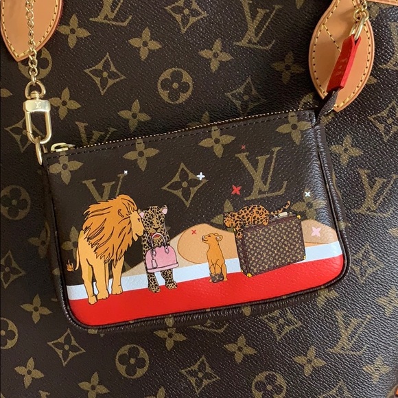 Louis Vuitton Accessories - Authentic mini pochette. Limited Release. Lions